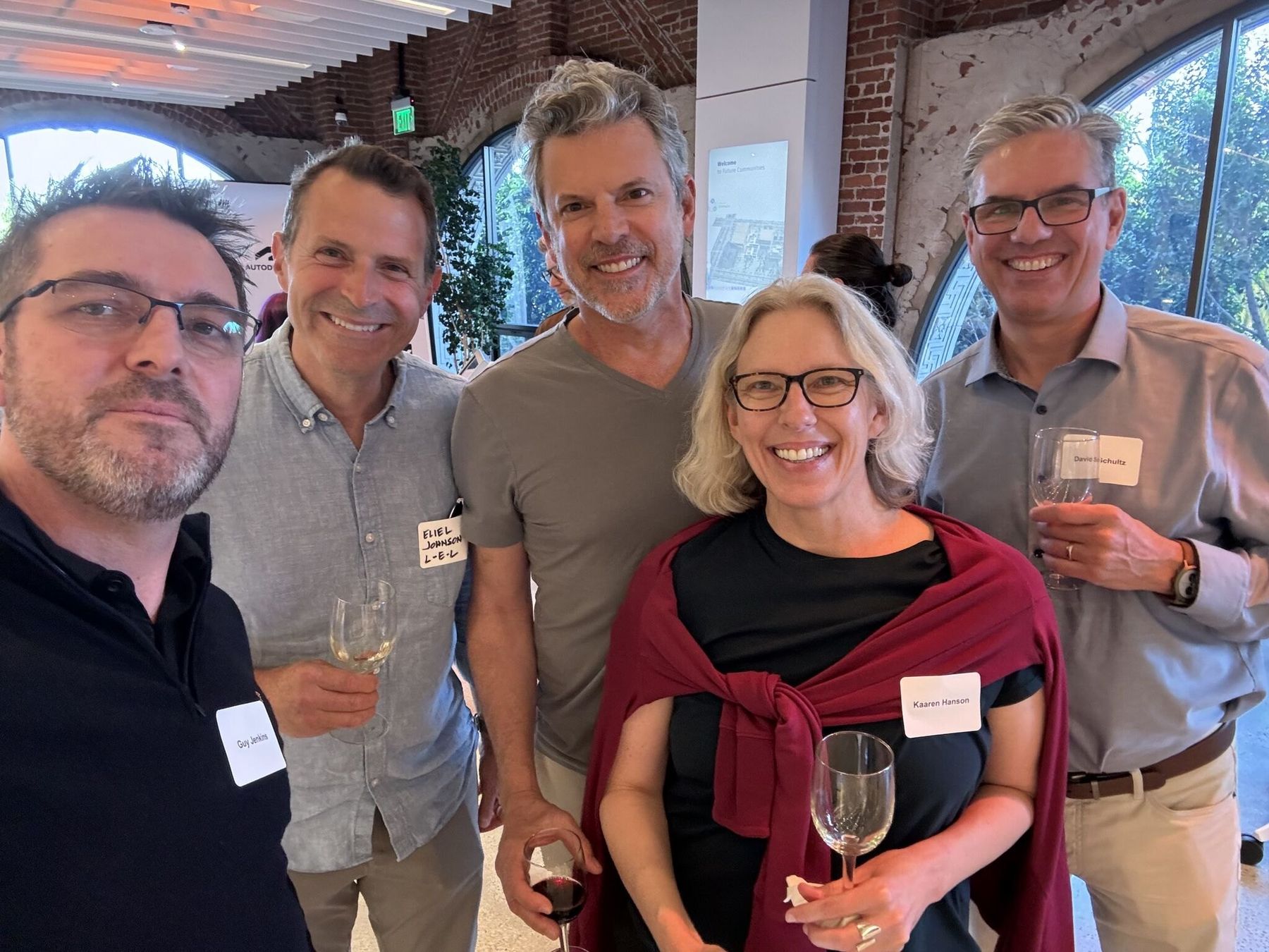 A group of members smiling together at a Design Leaders event