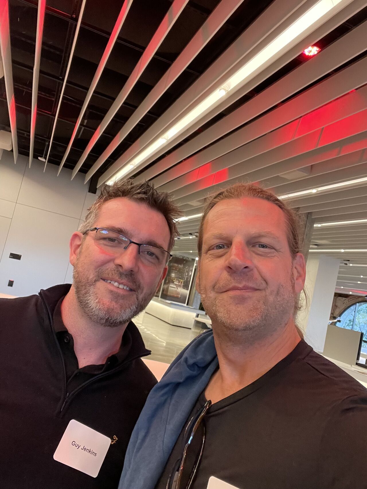Two members taking a selfie together at a Design Leaders gathering