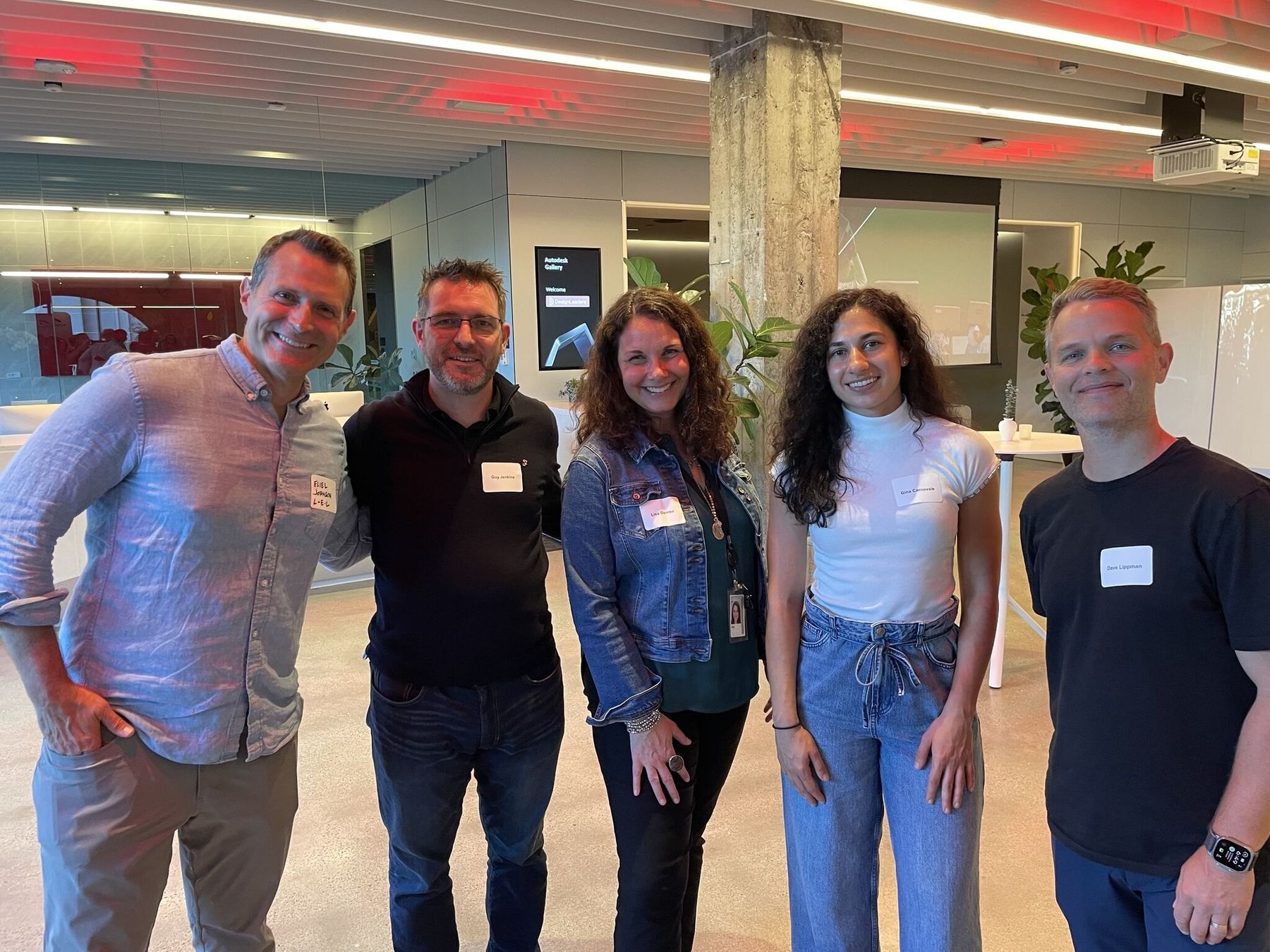 Members standing together at a Design Leaders gathering